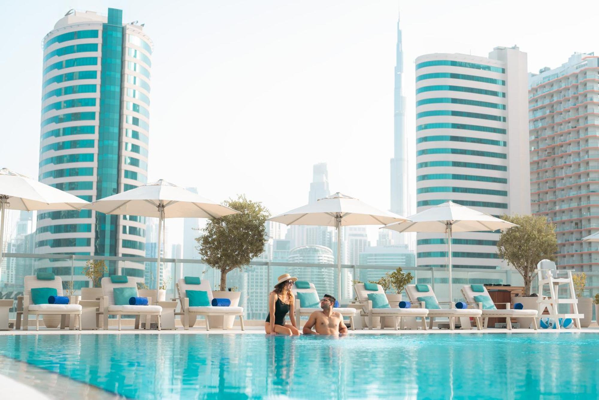 מלון The First Collection Dubai Business Bay מראה חיצוני תמונה "The pool is the best place to relax"